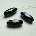 plastic 28x12 black faceted beads