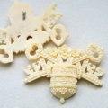 Ivory Floral Crown & Key celluloid emblem